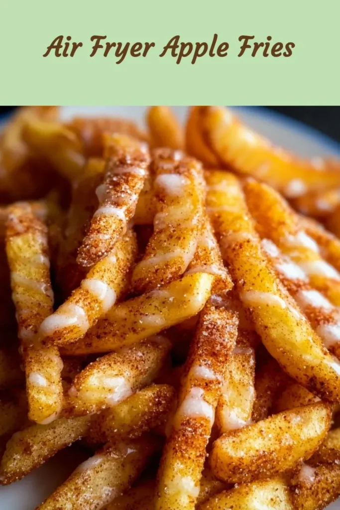 Crispy air fried apple fries served on a plate with cinnamon sugar.