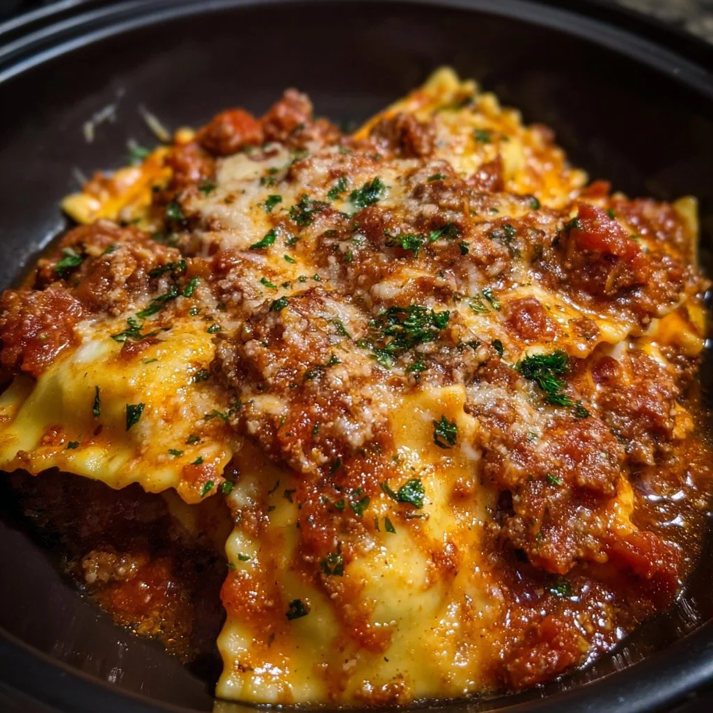 A delicious serving of Crockpot Ravioli Lasagna topped with melted cheese